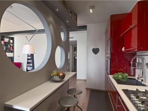 Home 8 Cocina reformada con isla y encimera de cuarzo en una vivienda de Santander